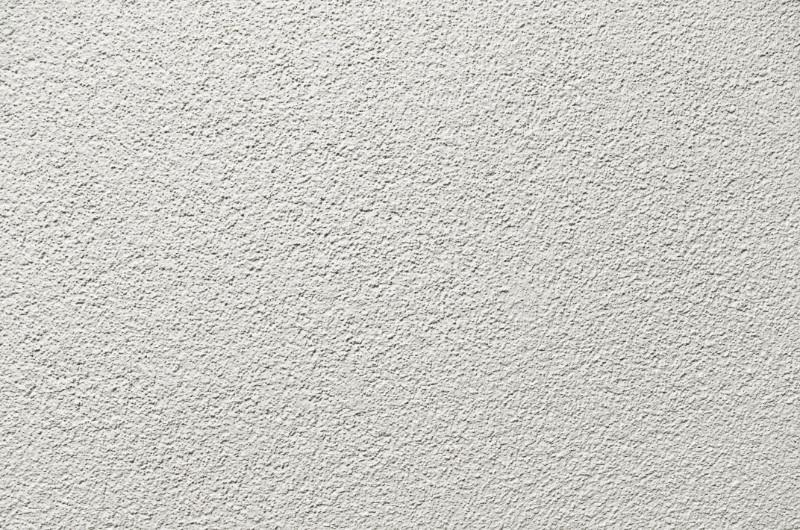 Gros plan d'un mur en crépis à Nantes